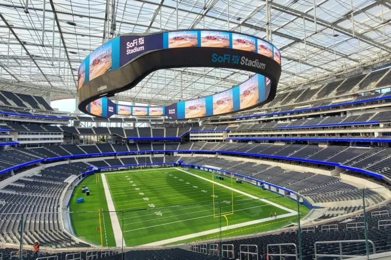 Large outdoor stadium LED video wall viewed from the seating bowl