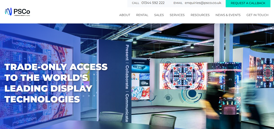 Exhibition hall with bright LED displays and digital screens; bold white text overlay reads 'Trade-only access to the world's leading display technologies.'