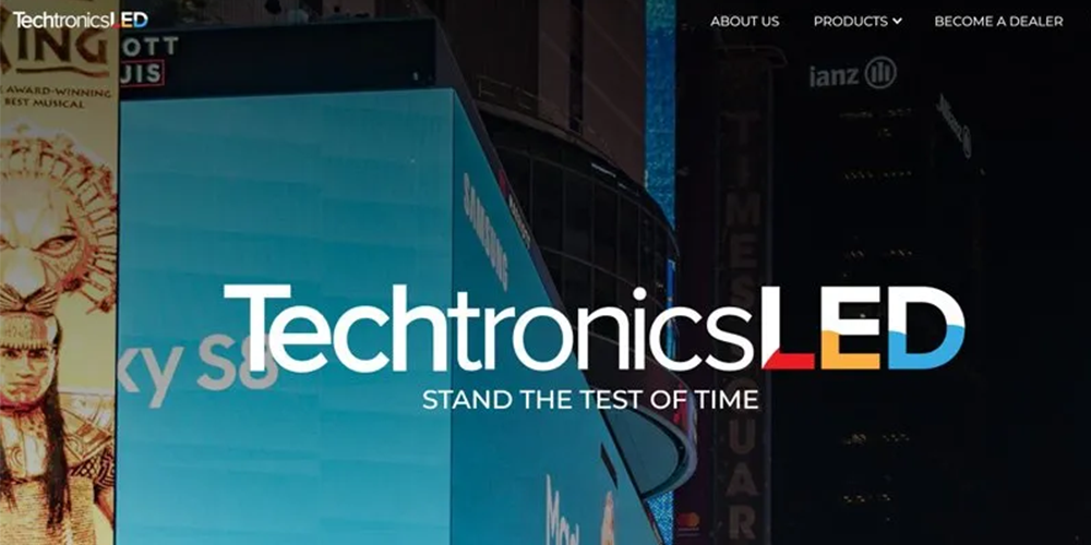 Nighttime urban billboard scene featuring the TechtronicsLED branding across a bright blue sign, with the slogan 'Stand the Test of Time' visible in white text.
