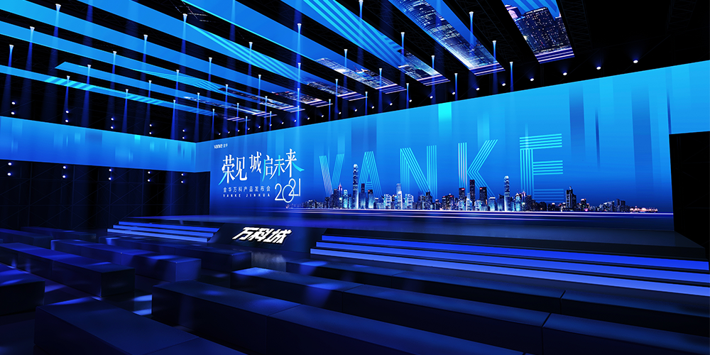 Novastar VX1000 -Corporate AV projects Blue-lit futuristic conference stage with a city skyline graphic on a large screen and tiered seating in the auditorium.