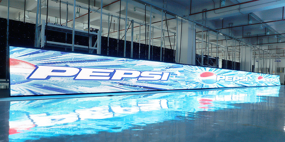 体5 Long Pepsi branded LED banner displaying the Pepsi logo on a glossy blue floor studio backdrop.