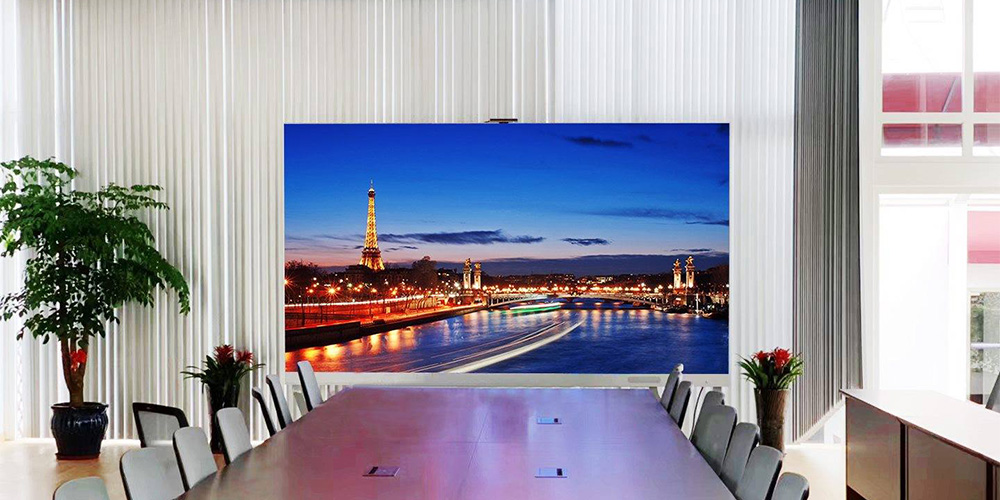 会议室LED - LED Screen Board - LED Screen Board Modern conference room with a long table and chairs, featuring a wall screen displaying a nighttime Paris skyline with the Eiffel Tower.