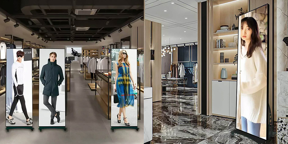 海报屏幕4 - LED Screen Board - LED Screen Board Wide view of a modern clothing store with tall poster displays of models, clothing racks, and a marble showroom floor.
