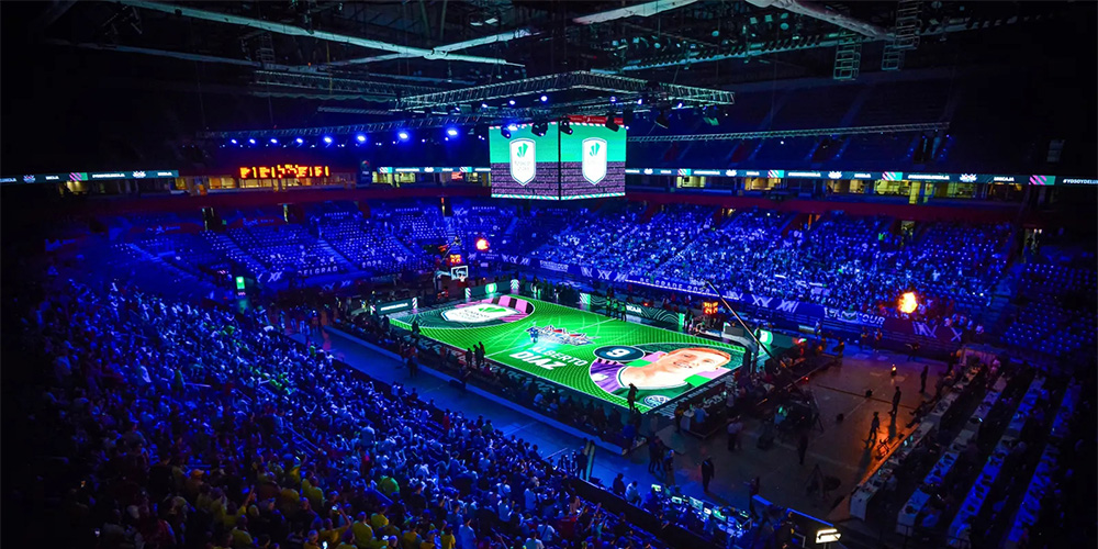 LED Display for Sports1 - LED Screen Board - LED Screen Board Indoor basketball arena filled with a large crowd, lit in blue with a bright, colorful court at center featuring large screens above.