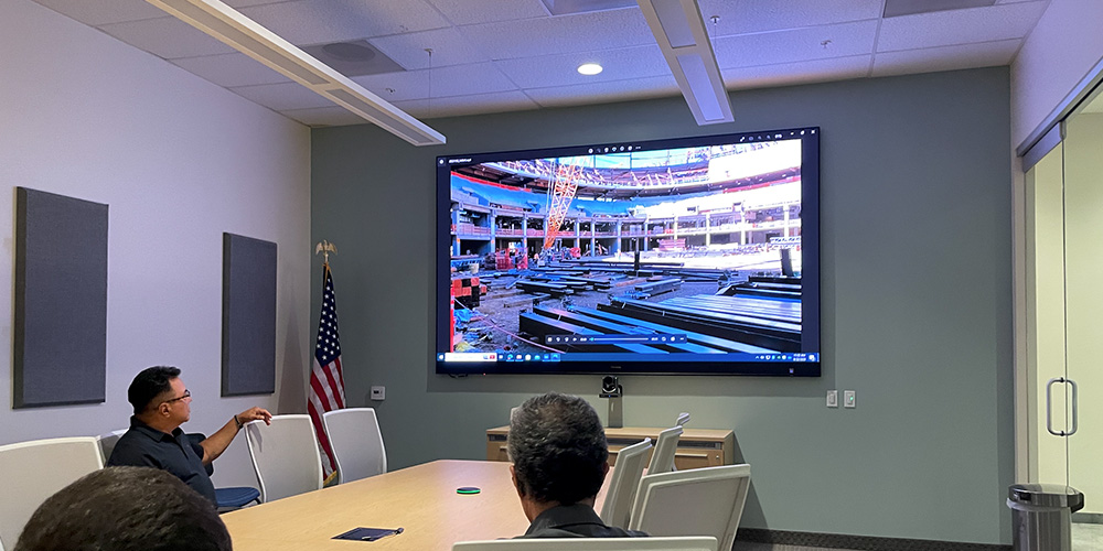 All-in-one LED display installed in a corporate meeting room