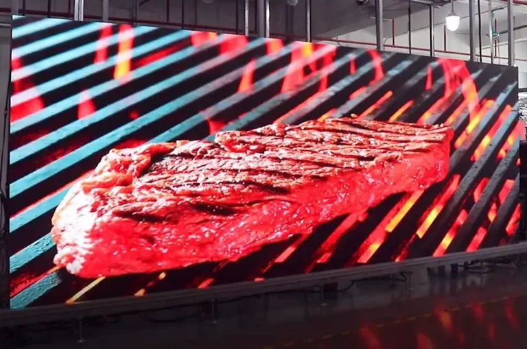 Assembled GOB LED display showing food imagery during a factory display check