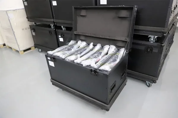 Open black wheeled flight case with protective packing for display equipment